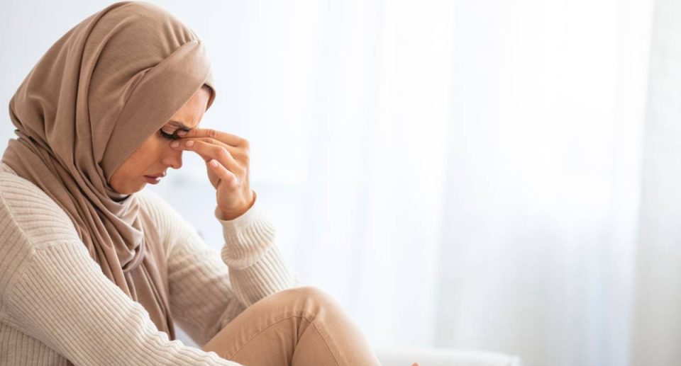 A Muslim woman feeling anxious